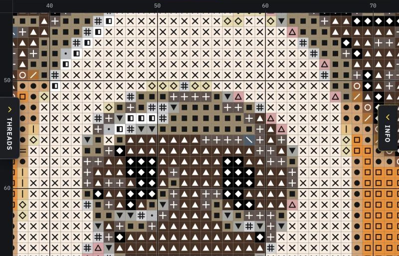 A close view of the chart: each square has a thread color and a symbol, with a heavier line every ten stitches and numbers along the edges
